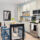 An apartment kitchen with white counters