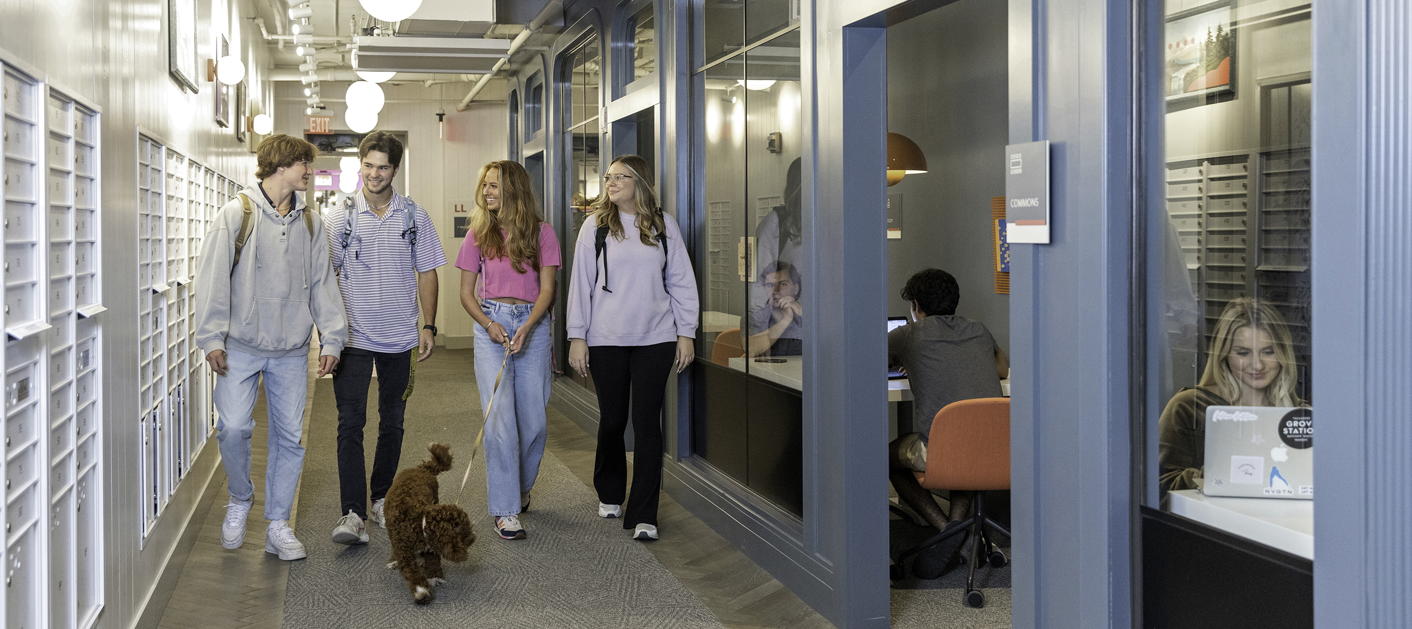 A group of friends walking a dog