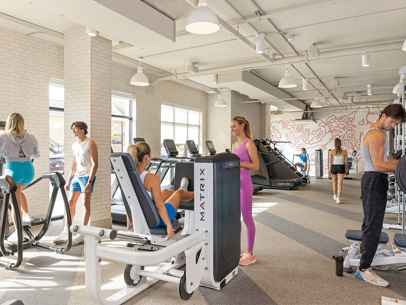 Friends working out at a fitness center