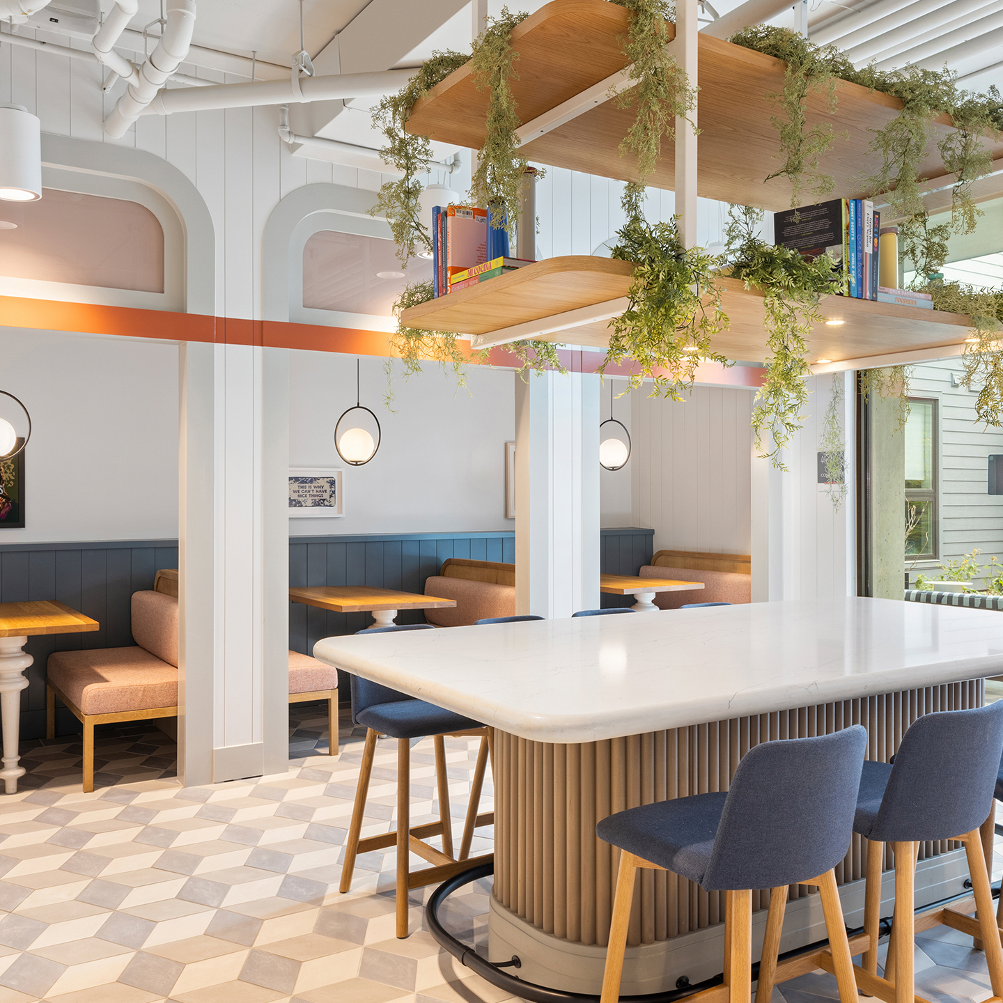 A desk surrounded by plants